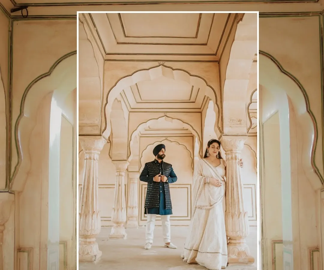 Capturing the essence of a royal Indian wedding, this couple stands amidst the stunning architecture of a Jaipur palace. This is for couples who dream of a heritage wedding filled with elegance.