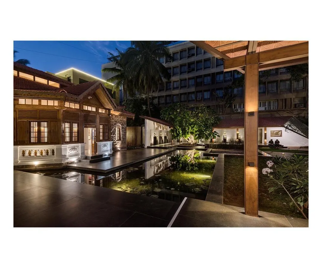 The KLE Centenary Museum at dusk, where restored heritage architecture meets new landscape interventions. The interplay of light, water, and structure creates a serene public plaza, transforming a historic site into a vibrant urban space.
