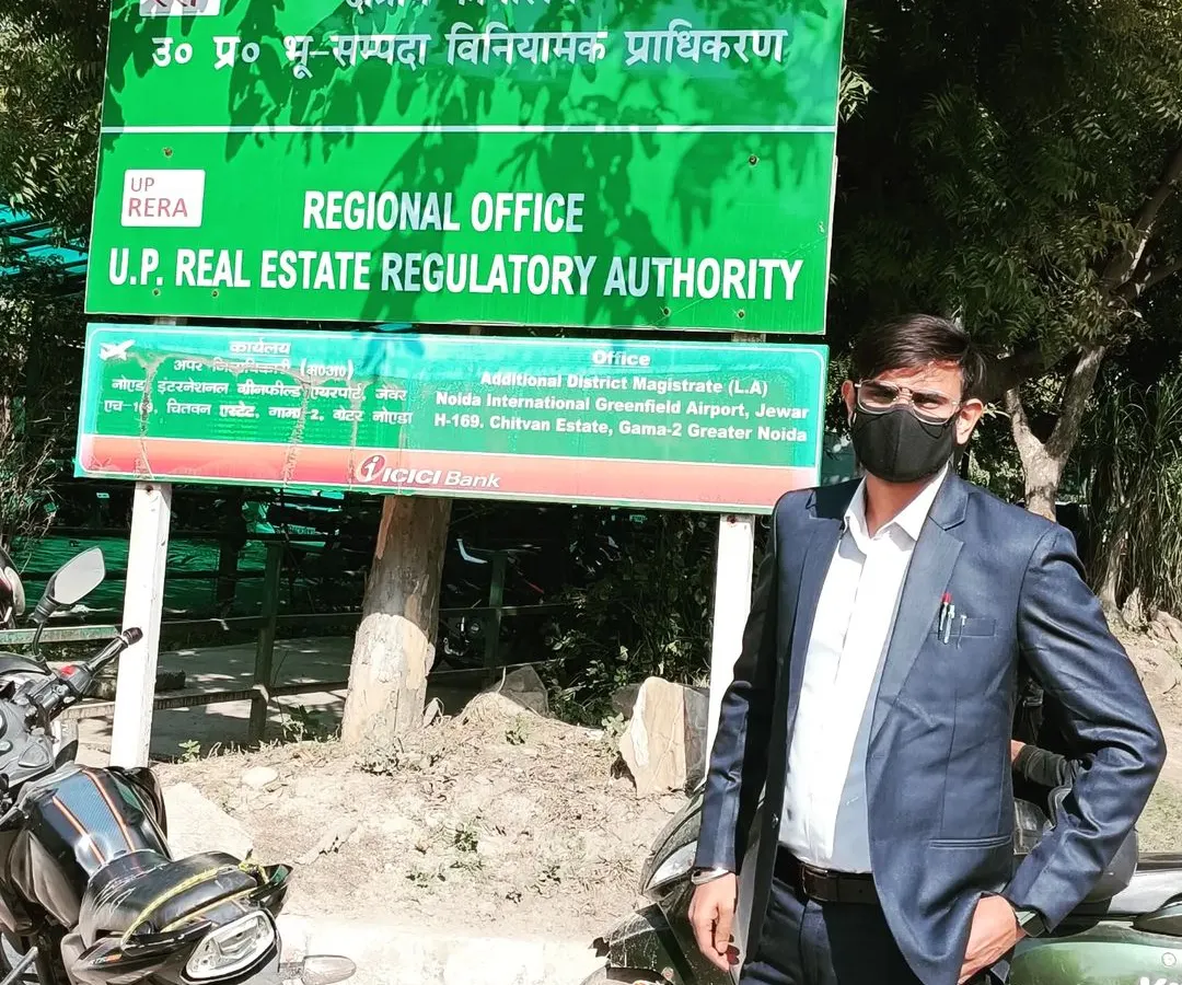 Standing outside the U.P. Real Estate Regulatory Authority (UP RERA) office. I have significant experience representing clients in property disputes, especially those involving builder issues and land problems covered under RERA.
