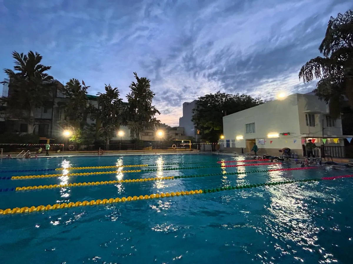 This is our professional, multi-lane swimming pool at the Manav Rachna campus, captured at dusk. We maintain our facilities to the highest standards to provide a clean, safe, and inspiring environment for both beginner and competitive swimmers.