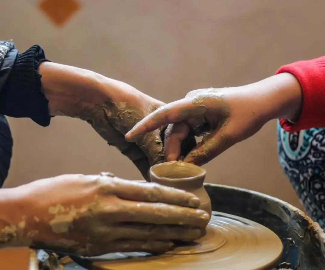 I guide little hands as they learn the art of pottery. This tactile experience helps children connect with natural materials, develop fine motor skills, and feel the immense satisfaction of creating something from scratch.