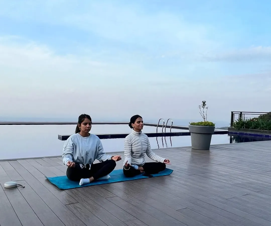 As a mother-daughter duo, we guide you together. Our shared practice, set against the serene backdrop of the Dharamshala mountains, reflects our belief in yoga as a lifelong journey of connection.
