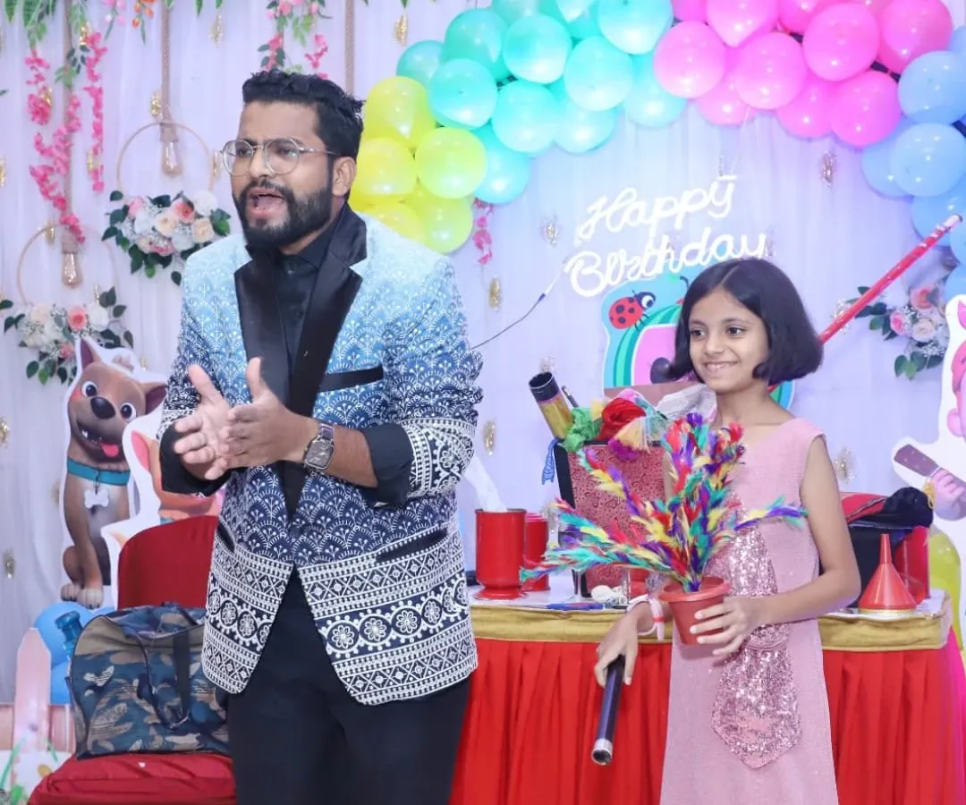 Seeing the look of wonder on a child's face is the best part of my job. Here, I'm sharing a special magical secret with my young assistant during a lively birthday party show.