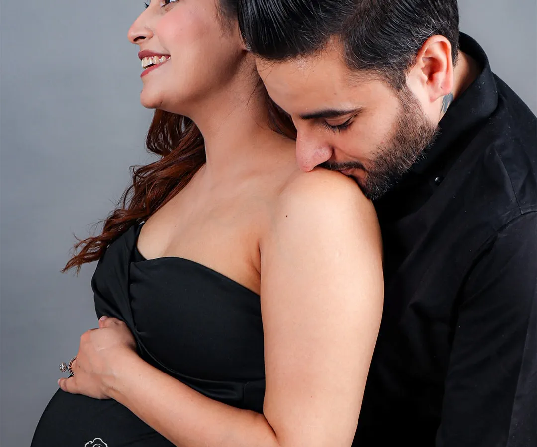 The journey to parenthood is a shared one. I love capturing these quiet, intimate moments between partners, where the world fades away and only the love for each other and your coming baby remains. This is a classic couples maternity portrait that focuses on connection and tenderness.