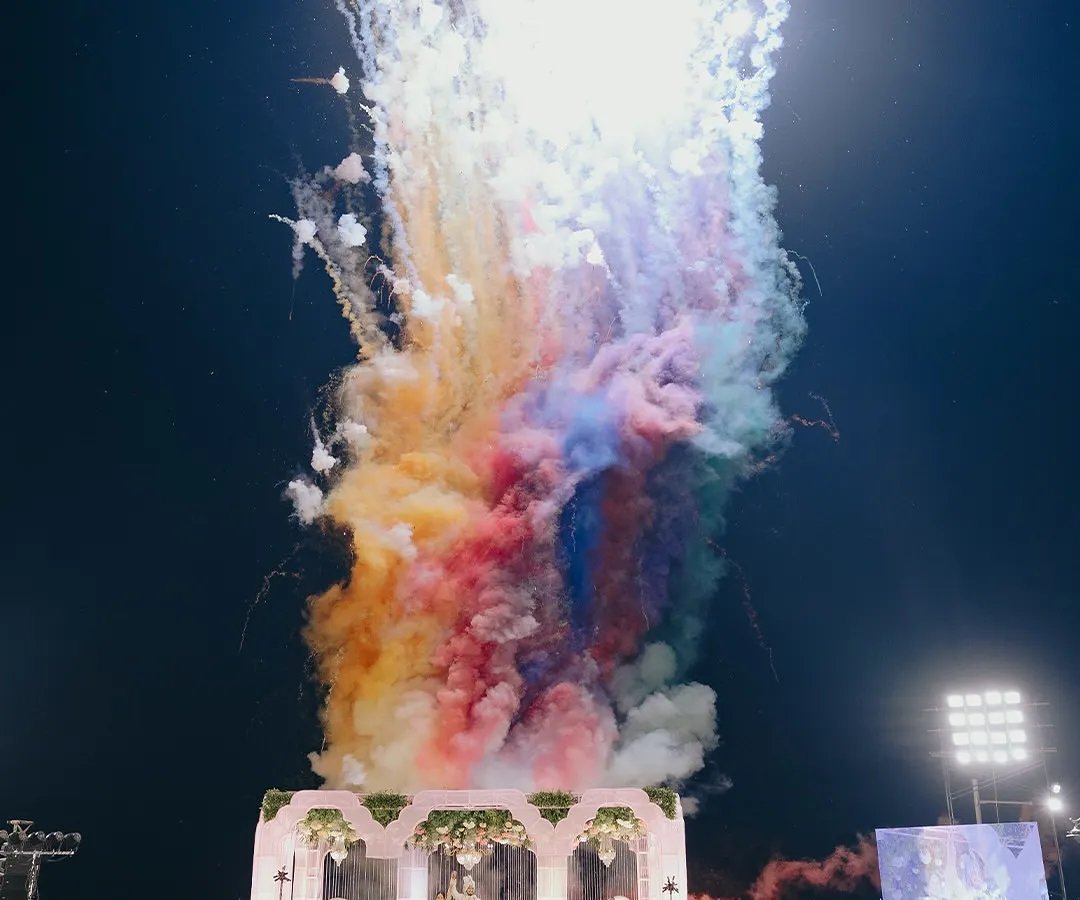 I believe in creating moments that feel larger than life. This spectacular display of colorful fireworks over the wedding mandap was the perfect crescendo to a beautiful ceremony, lighting up the night and the hearts of everyone present.