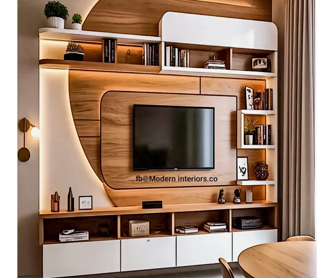 This modern entertainment wall combines form and function with its curved wood paneling and integrated ambient lighting. The design features a mix of open shelving for decor and closed cabinets for concealed storage, creating a sleek and organized focal point for the living room.