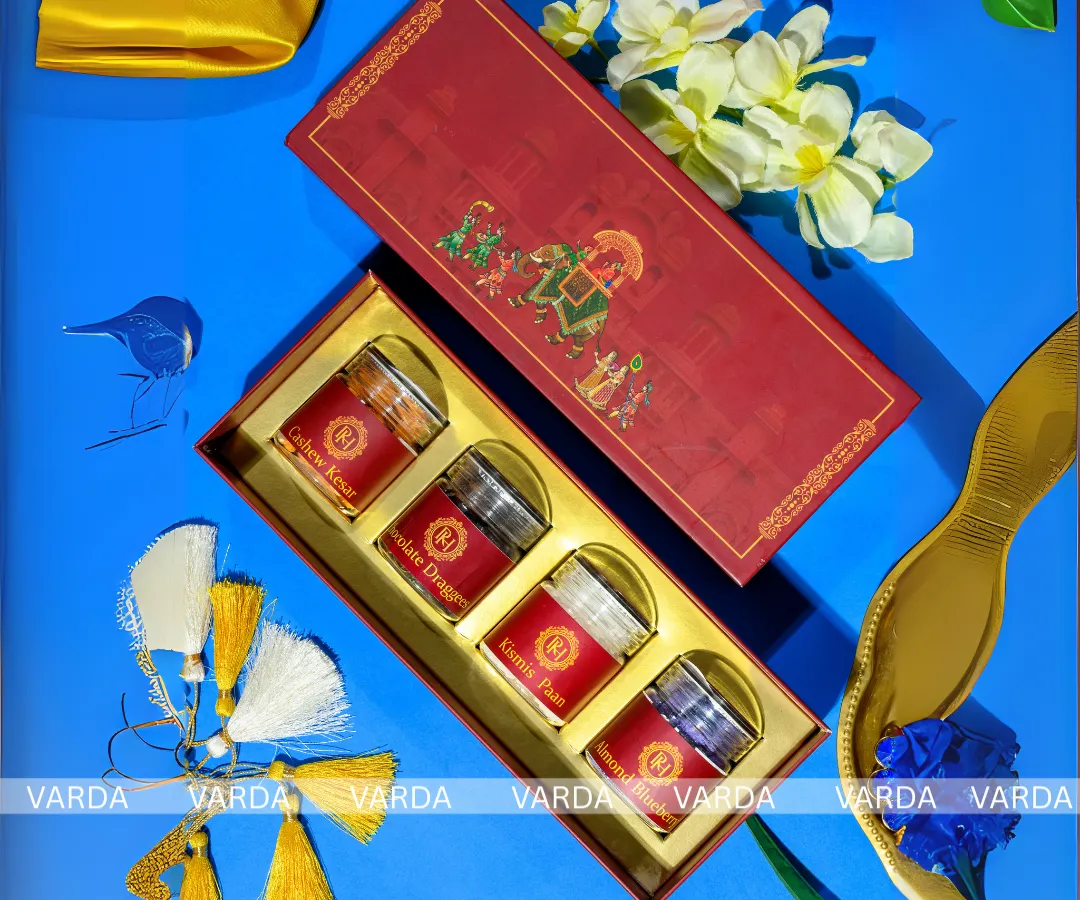 I bring grandeur to your celebration with this Royal Procession wedding gift box. The rich red and gold palette, combined with traditional Indian artwork, offers a truly regal unboxing experience for your guests.