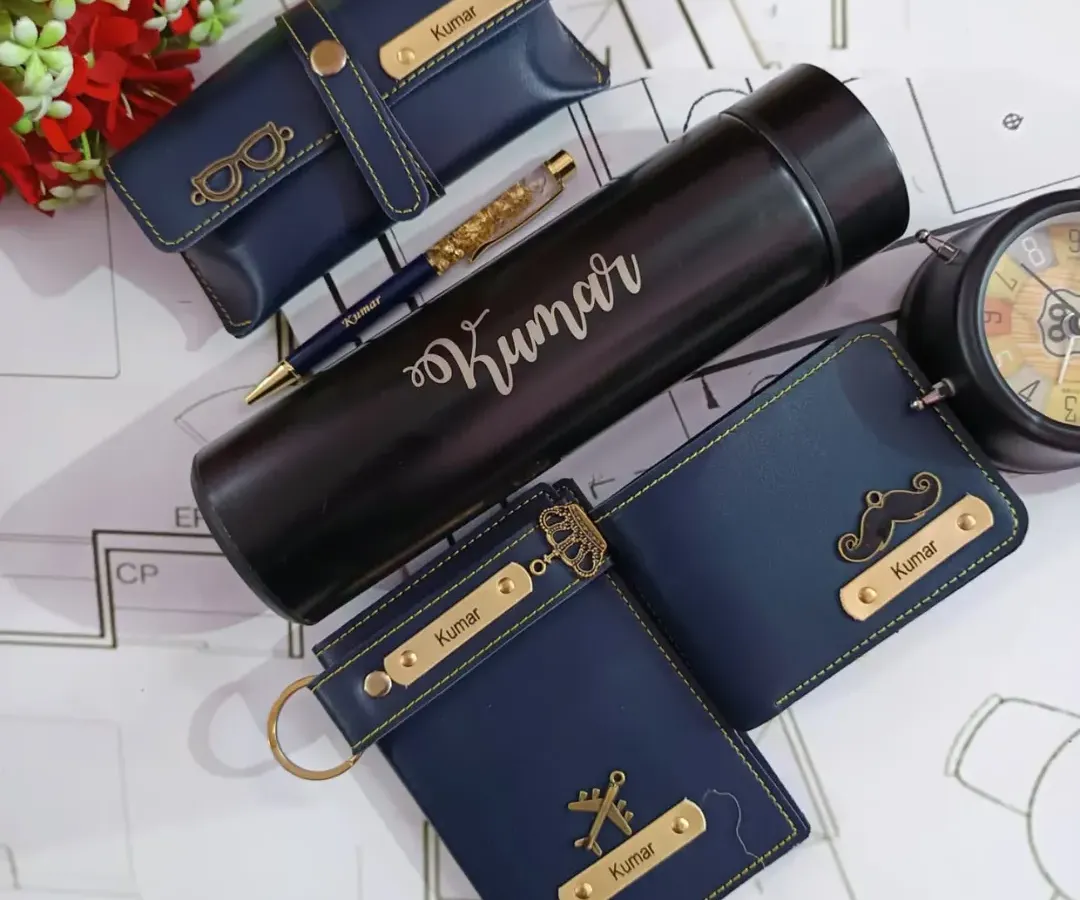 This is one of my most popular gift sets for men, featuring a complete collection of personalized faux leather accessories. It includes a name-engraved wallet, temperature bottle, passport holder, and keychain, all coordinated in a stylish navy blue.