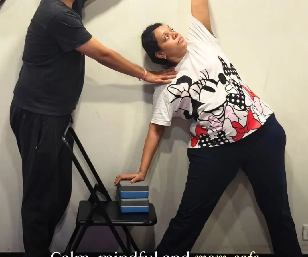 Your safety is our highest priority. Here, you can see how our certified instructors provide hands-on adjustments to ensure perfect alignment and support in every pose, making each movement both safe and effective for you and your baby.