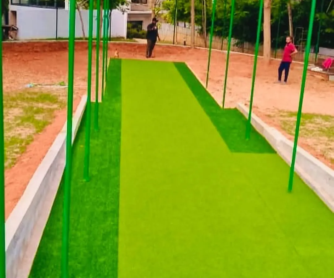 Here is a professional cricket practice pitch we recently completed. We installed a high-density synthetic turf specifically designed to handle heavy use from both batsmen and bowlers, providing a true and consistent bounce. This all-weather surface is perfect for academies, clubs, or even private residences, ensuring your training never stops.