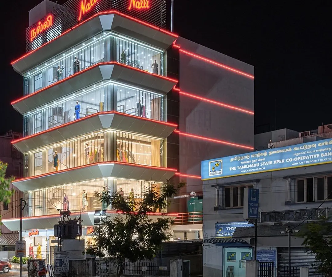 In contrast to my earth-based projects, this is the flagship Nalli store in Chennai, illuminated at night. The design transforms the building into a beacon, showcasing my capability in handling large-scale, modern commercial architecture and creating a strong brand presence in a dense urban landscape.