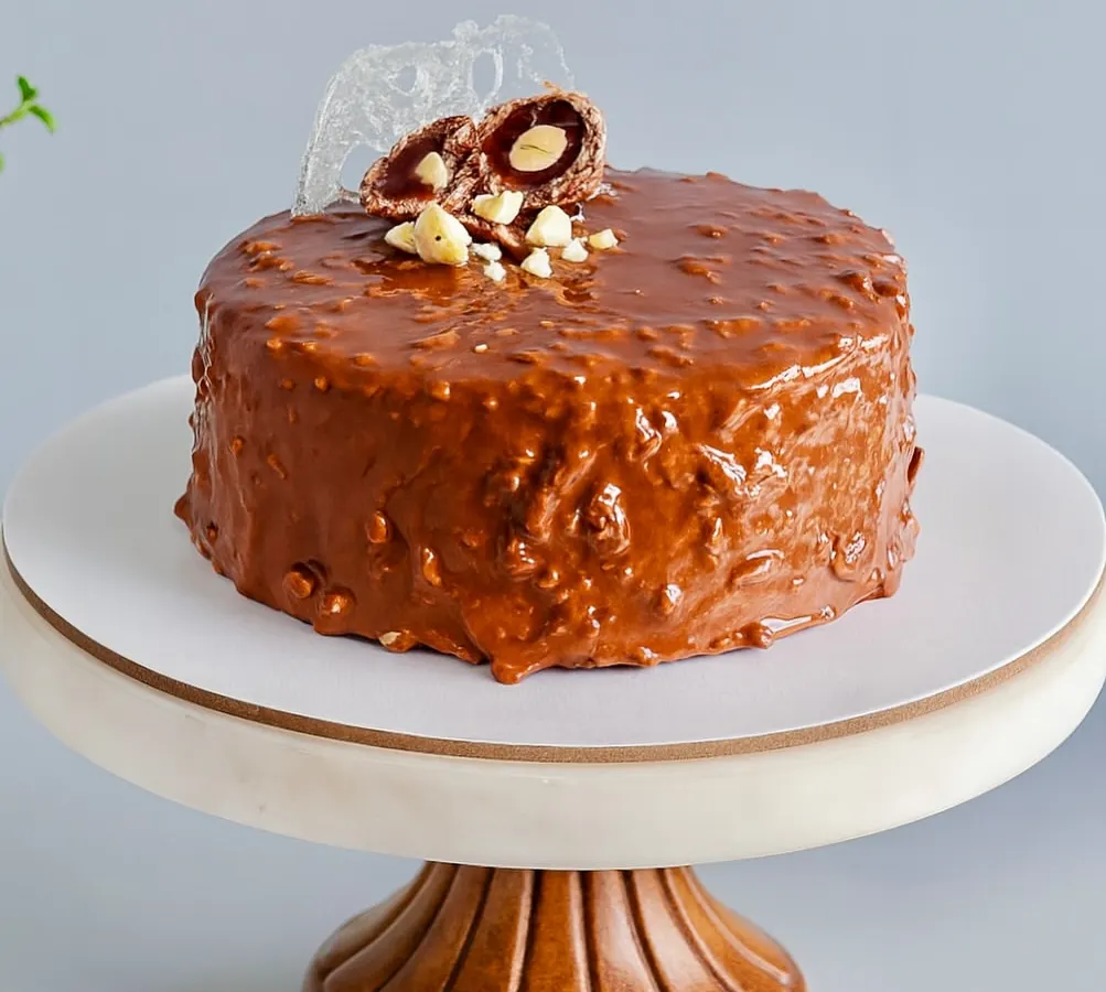 This is my bestseller for a reason. The Almond Rocher Cake has layers of rich chocolate sponge and Nutella, all wrapped in a crunchy almond chocolate glaze. It’s an experience of textures, from the hard outer shell to the dreamy, soft inside.