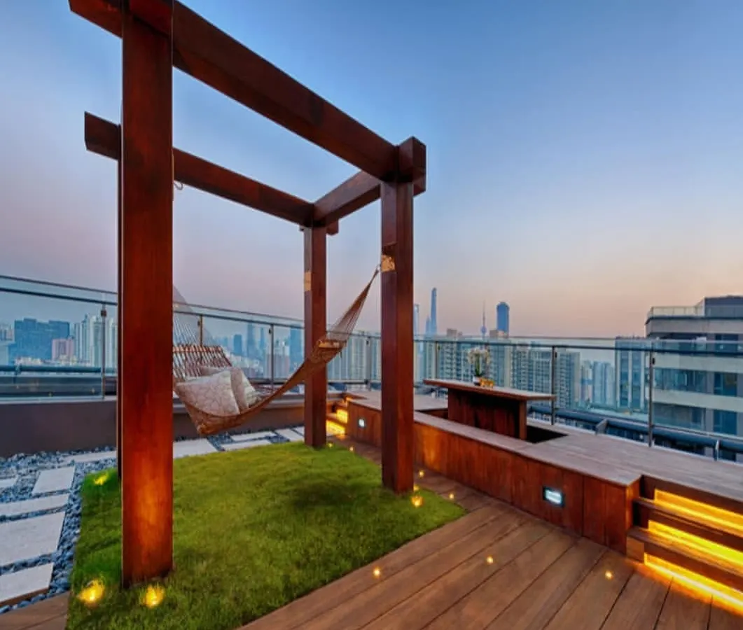 We design urban sanctuaries that offer an escape from the city bustle. This rooftop terrace project combines natural grass, warm wood, and ambient lighting to create a perfect relaxation spot, complete with a hammock overlooking the skyline.