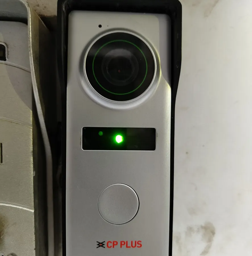 Here is the outdoor camera unit we install at your entrance. It has a high-quality 1.2 MP camera and powerful night vision, so you get a clear picture day or night. This is a genuine CP Plus video door phone camera, built to last.