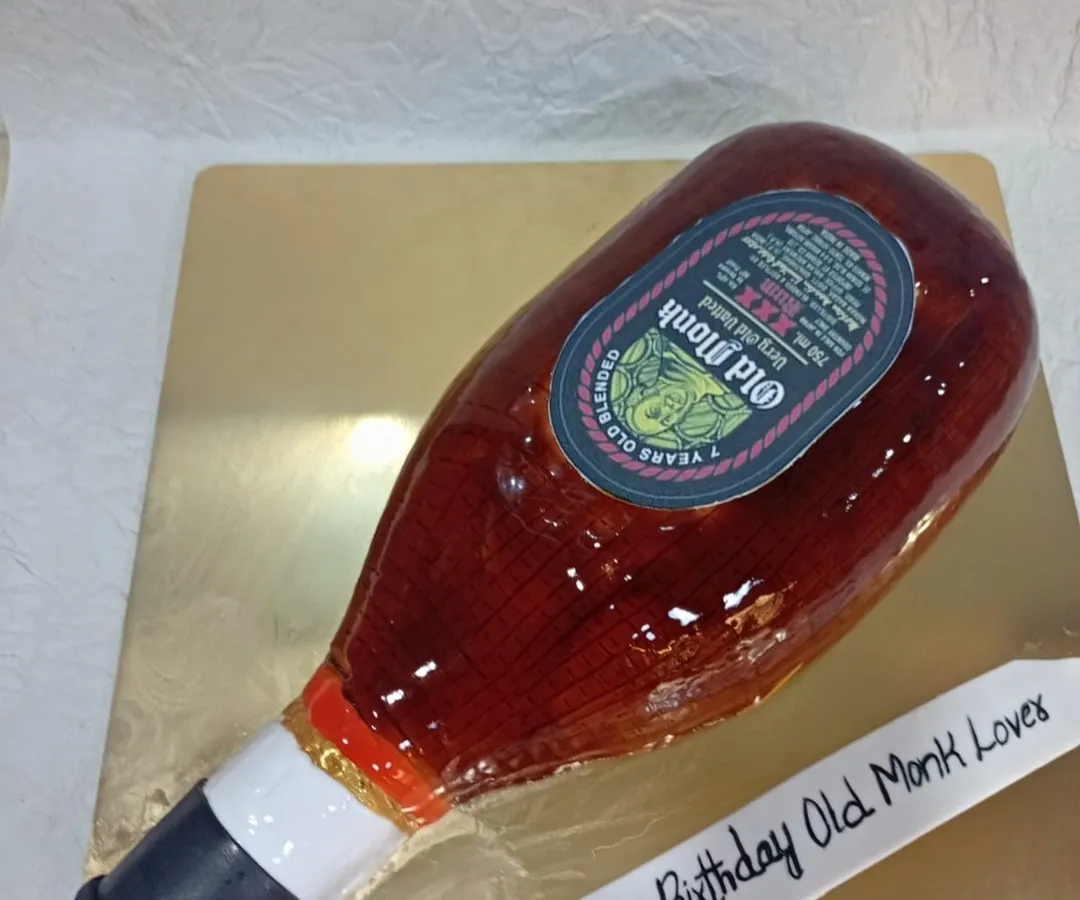 Can you believe this is a cake? I specialize in hyper-realistic designs like this Old Monk bottle cake, perfect for surprising someone with a truly unique and memorable sculpted dessert.