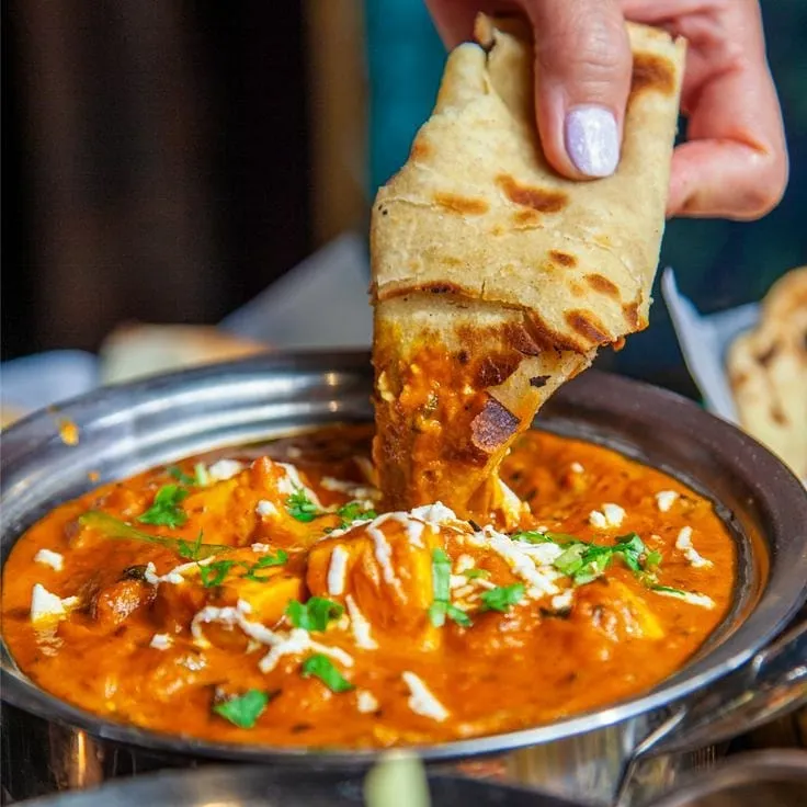 There's nothing like dipping a warm, soft roti into a creamy paneer curry. This is our Paneer Butter Masala, a crowd favourite, prepared with fresh paneer and a rich, flavourful tomato gravy.
