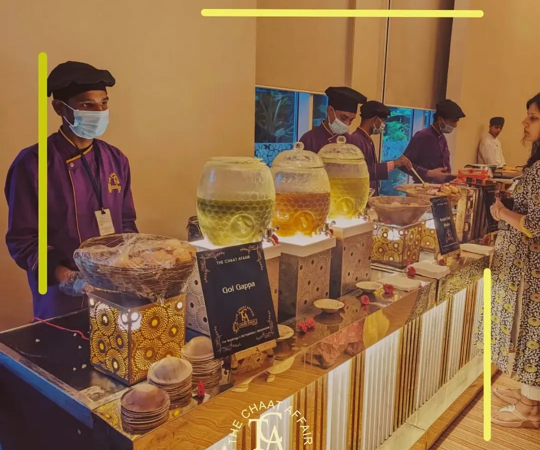 Our Gol Gappa station is always the center of attention. Here you can see our elegant, well-lit counter where our expert staff serves guests with a variety of flavored waters, ensuring every bite is a perfect explosion of authentic Dilli street food flavor.