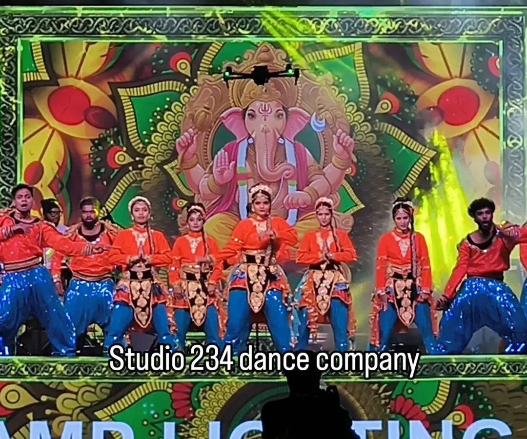 We begin many auspicious corporate events with a traditional Ganesh invocation. Our dancers, in vibrant orange and blue costumes, perform against a large LED screen displaying sacred imagery, setting a powerful and respectful tone for the evening.
