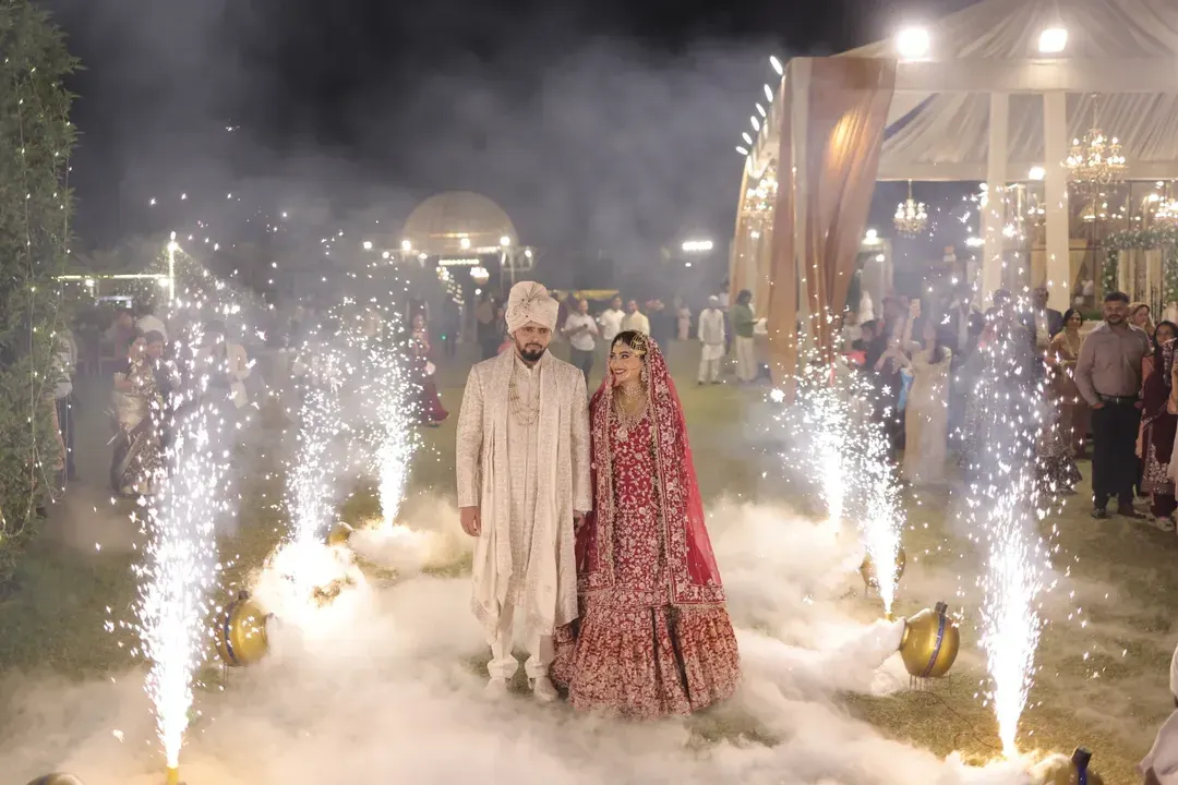 A fairytale entrance for a new beginning. I use elements like smoke and sparklers to frame couples in a grand, cinematic style, making their big moment feel like a scene from a movie.