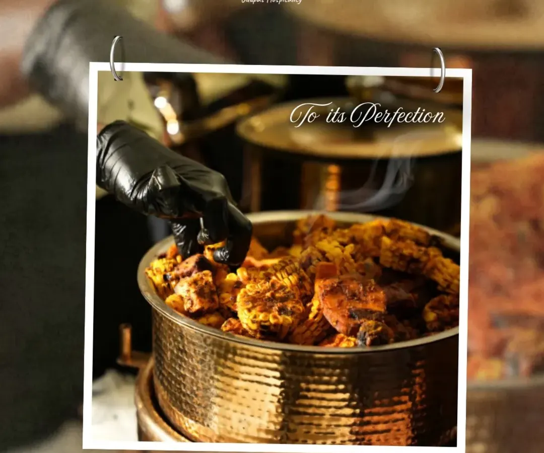 This steaming pot of vegetarian curry, served in a traditional hammered copper vessel, showcases our dedication to authentic flavors and meticulous preparation. We ensure every dish is perfected with passion before it reaches your guests.