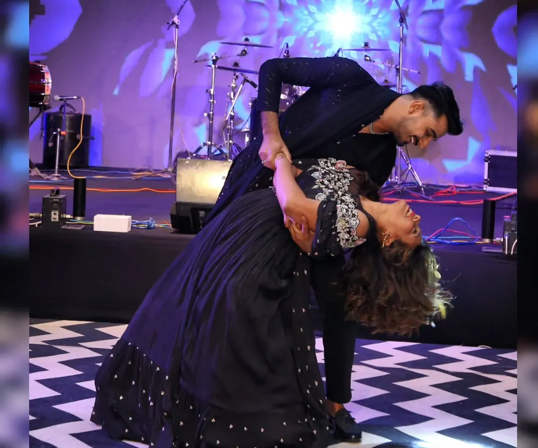 This is the kind of magical moment we love to create. A perfect dip on stage captures the romance and joy of a couple's first dance. We focus on creating beautiful poses like this that make your wedding photos and memories unforgettable.