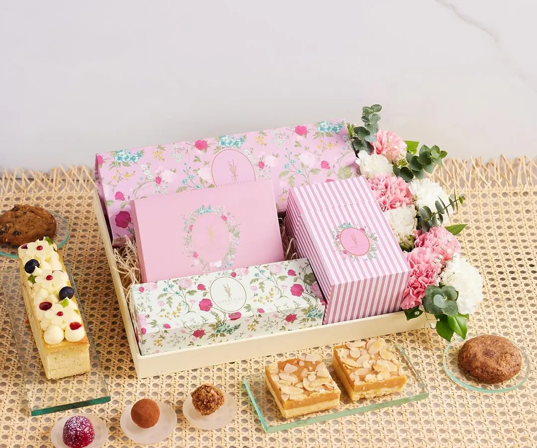 An elegant dessert hamper, thoughtfully curated with a selection of our finest handcrafted treats and fresh flowers. It’s the perfect way to share joy and celebrate life’s sweetest moments.
