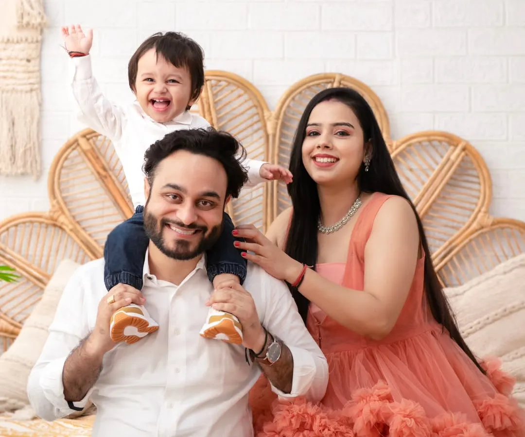 The pure bliss of family. Moments like this, with a child held high and surrounded by love, are what we will freeze in time together. This is more than a photo; it's the feeling of home.