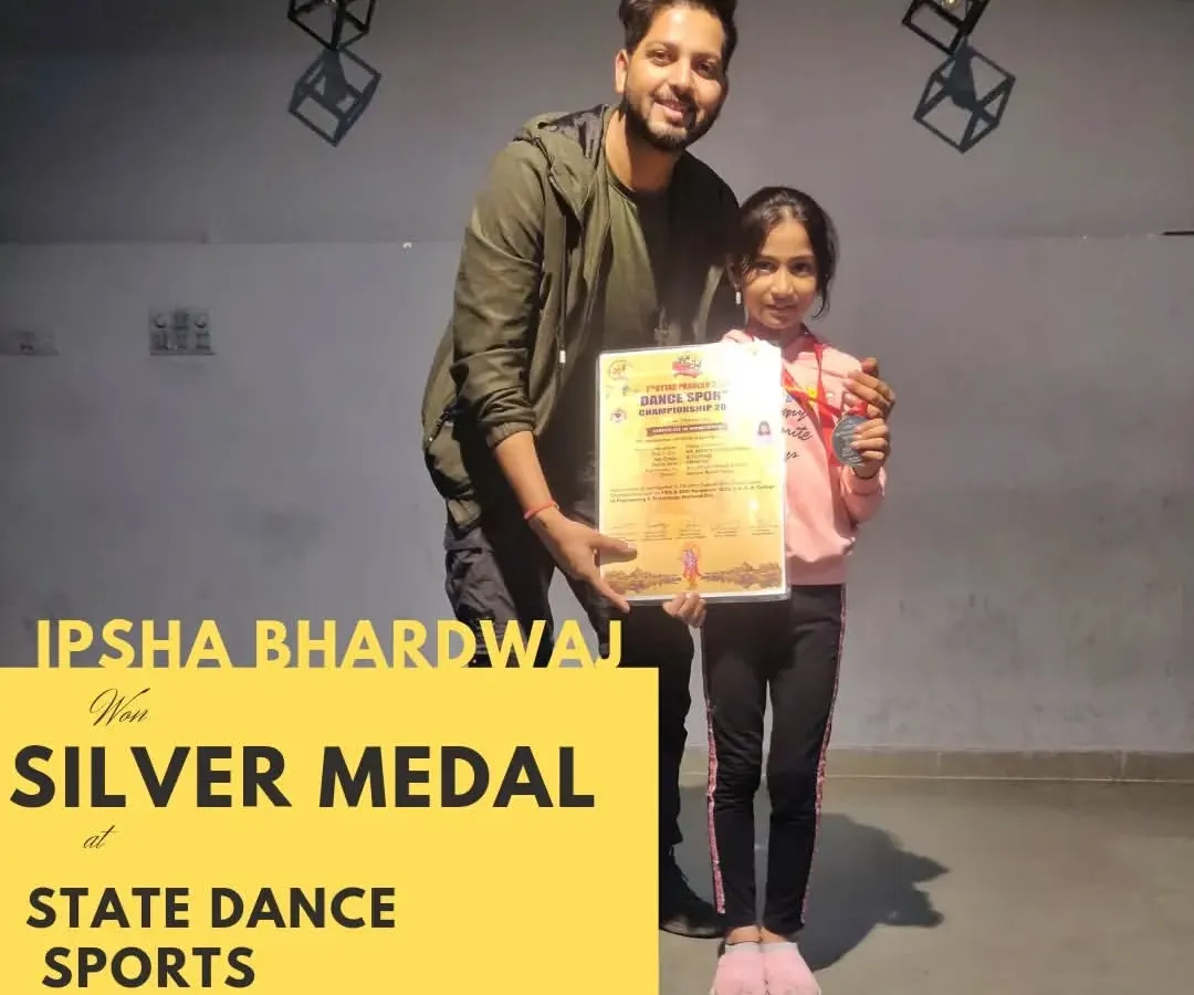 I am incredibly proud of my student, Ipsha, holding her certificate and silver medal from the State Dance Sports Championship. My goal is to mentor kids and help them achieve their best, celebrating every milestone along the way.