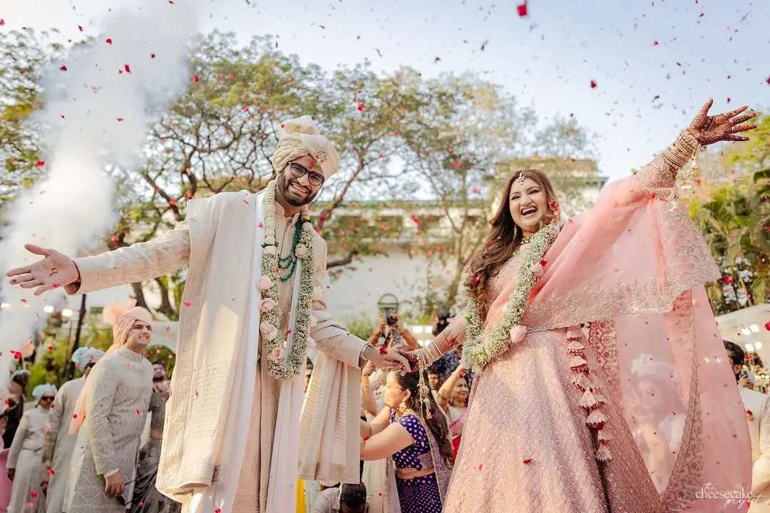 That just-married feeling! Capturing the explosion of joy, cheers, and a shower of petals during the varmala is one of my favorite parts of the day.