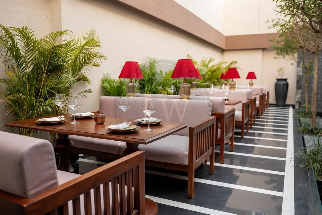 This is what understated luxury looks like. For the elegant outdoor dining space at Addonis, we designed and built these custom wooden banquettes and tables to be both beautiful and durable enough for the outdoors.