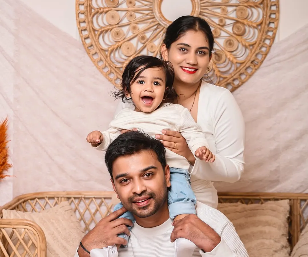 The heart of our work is capturing the love that holds a family together. This beautiful portrait, with its warm tones and genuine smiles, freezes a happy moment in time for this family to cherish forever.