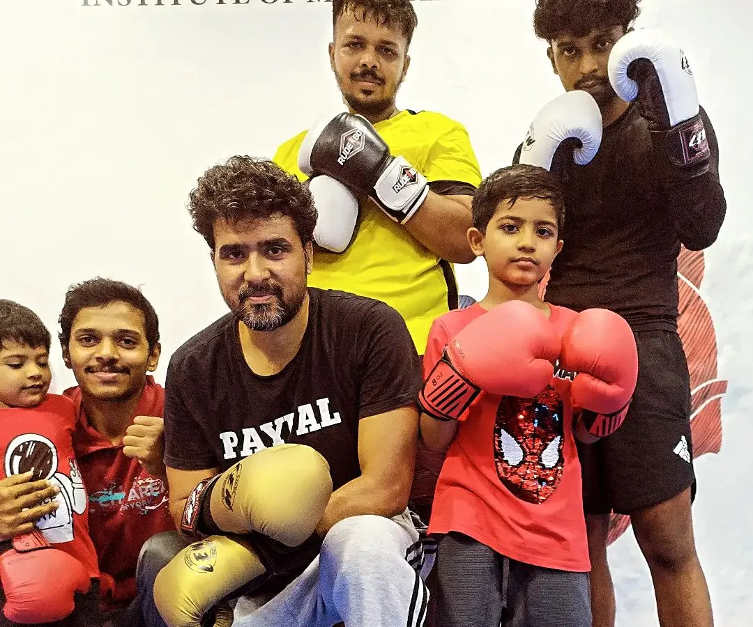 Here I am with some of our students, from the youngest kids to the adults. This picture captures the family atmosphere we have. Everyone, no matter their age or skill level, is part of the team.