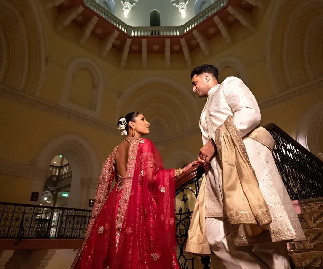 A moment of quiet grandeur. I love using dramatic architecture to frame a couple's story, making their portrait feel as epic as their love is. This is a classic editorial shot from a Mumbai wedding.