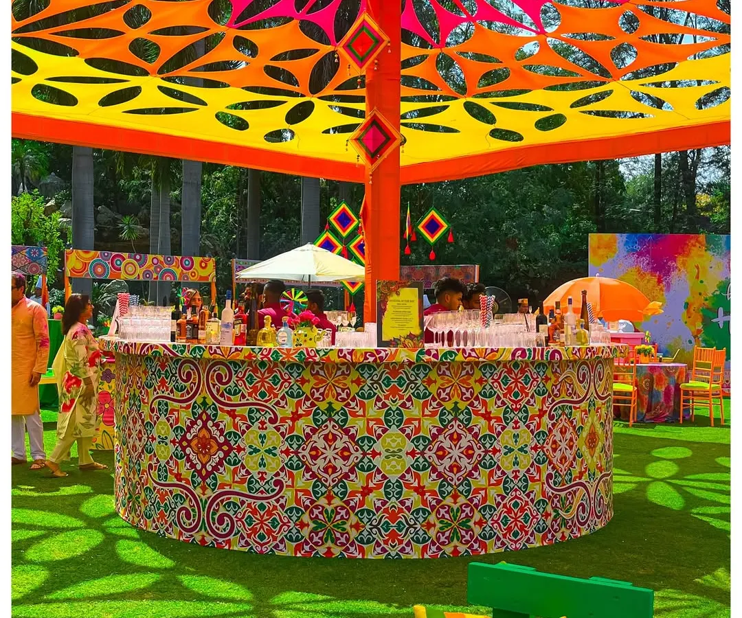 This circular bar was the centerpiece for a vibrant Holi festival. The intricate patterns, custom canopy, and explosive colors show how I can build a high-energy, branded experience for large-scale outdoor events.