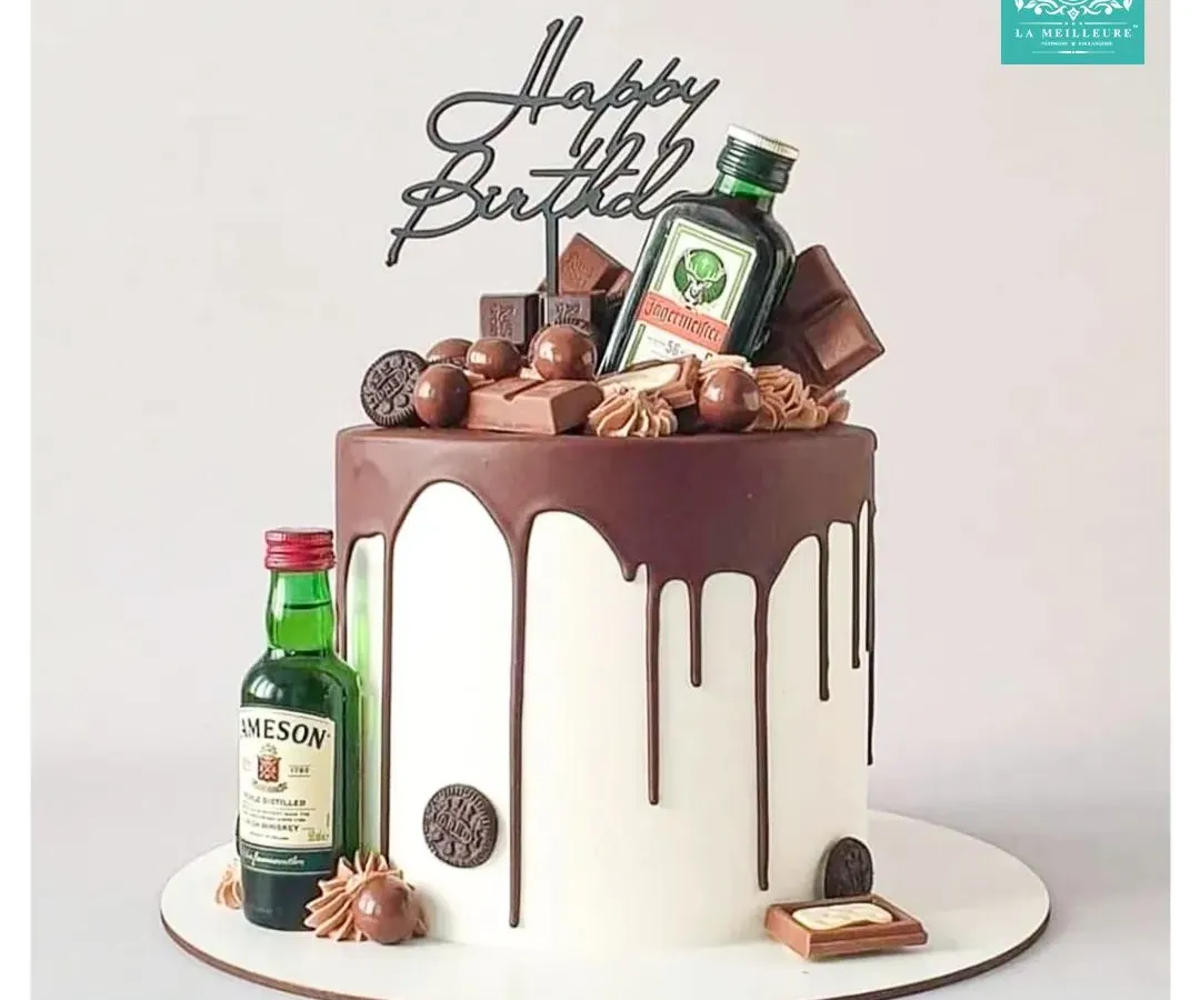 I love bringing your unique ideas to life, like this fun birthday cake for a whiskey enthusiast. This custom creation features a rich chocolate drip, chocolate bar decorations, and miniature bottles of Jameson and Jägermeister for a truly personal touch.