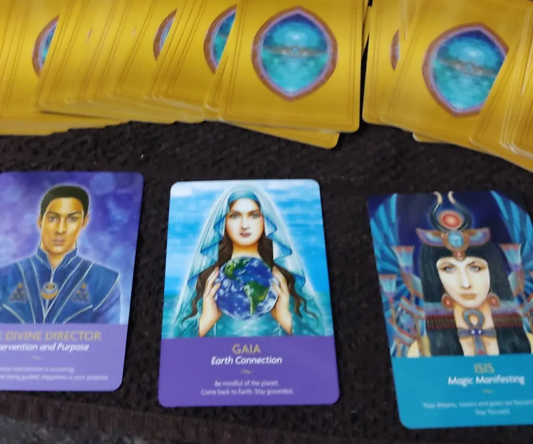 This is an example of a three-card spread using an Oracle deck, focusing on healing and purpose. Here, the cards for Divine Director, Gaia, and Isis point towards intervention, grounding, and manifestation. Each reading is a personal message for you.