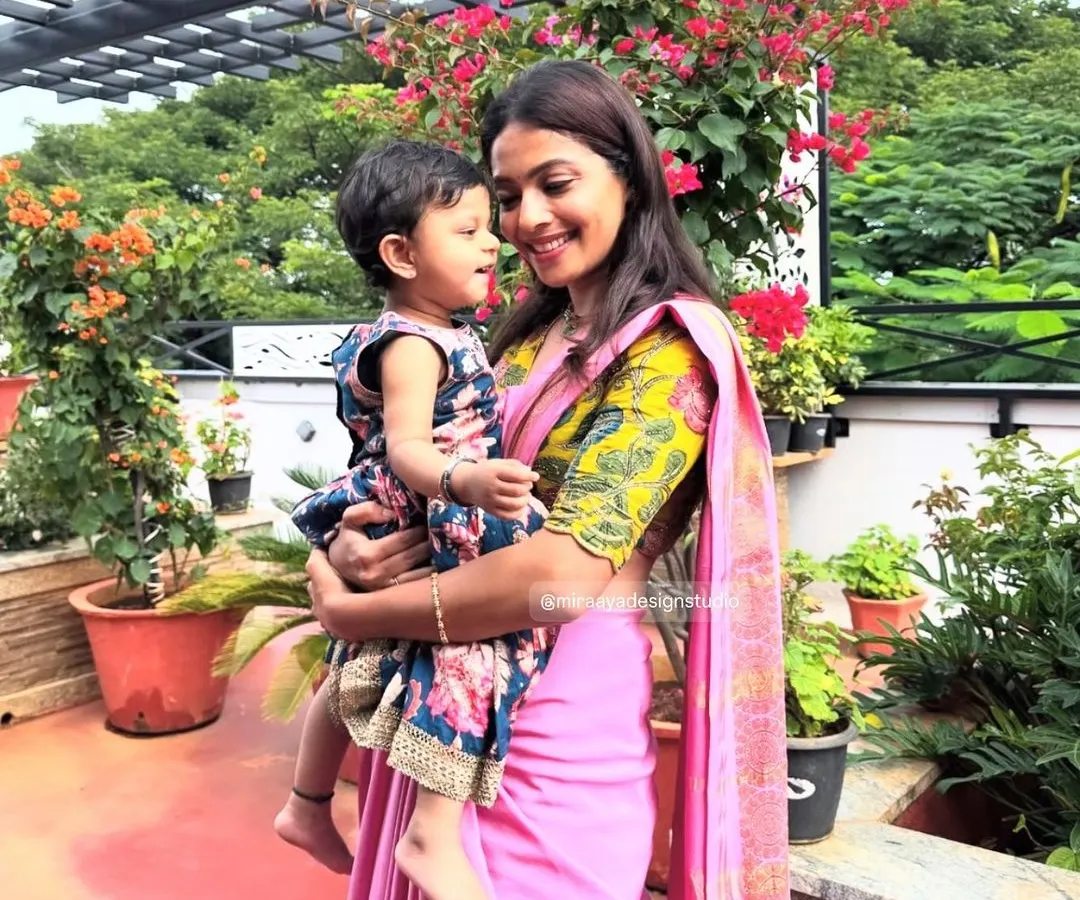 A perfect example of a 'Mommy and Me' concept. I used the vibrant floral fabric from the mother's blouse to create a matching dress for her daughter. It's these little details that create a special connection and make for beautiful photos.