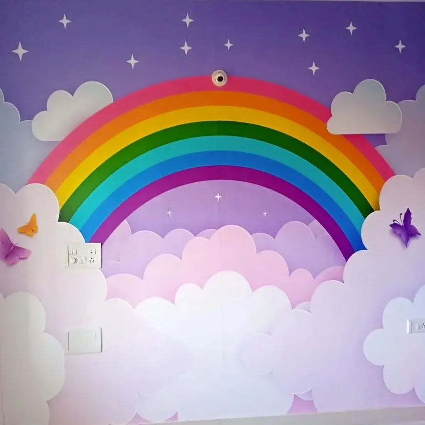 I love working on kids' rooms because the possibilities are endless. This vibrant rainbow and clouds mural creates a cheerful and imaginative wonderland, turning a plain wall into the highlight of the room.