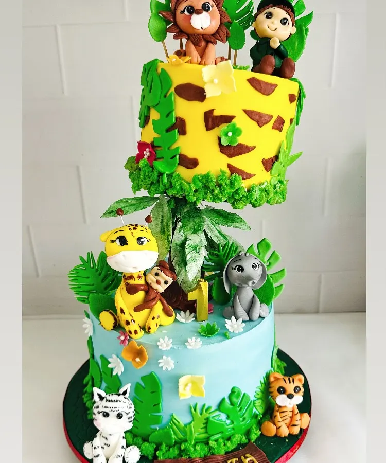 Welcome to the jungle! This gravity-defying cake was a joy to create for a little explorer's first birthday. Every animal is handcrafted from fondant, and the floating tier adds a touch of wild magic to the celebration.