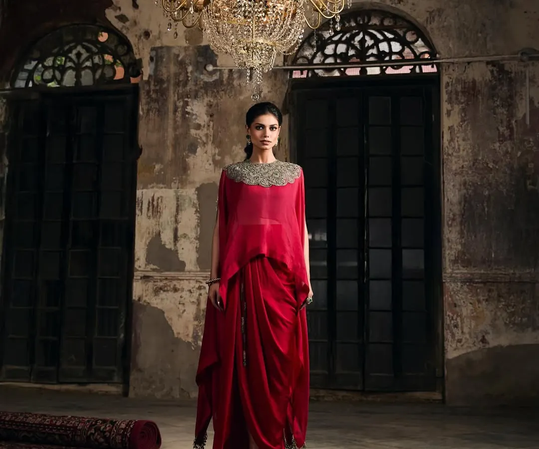 This is where modern drama meets timeless elegance. I love helping clients find showstopping pieces like this draped red gown with an embellished neckline, perfect for making an unforgettable entrance at a wedding reception or gala.