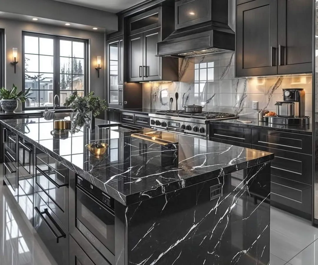 I design luxurious kitchens that are both beautiful and highly functional. This black marble island kitchen features high-gloss cabinetry, integrated appliances, and dramatic lighting to create a statement space for cooking and entertaining.