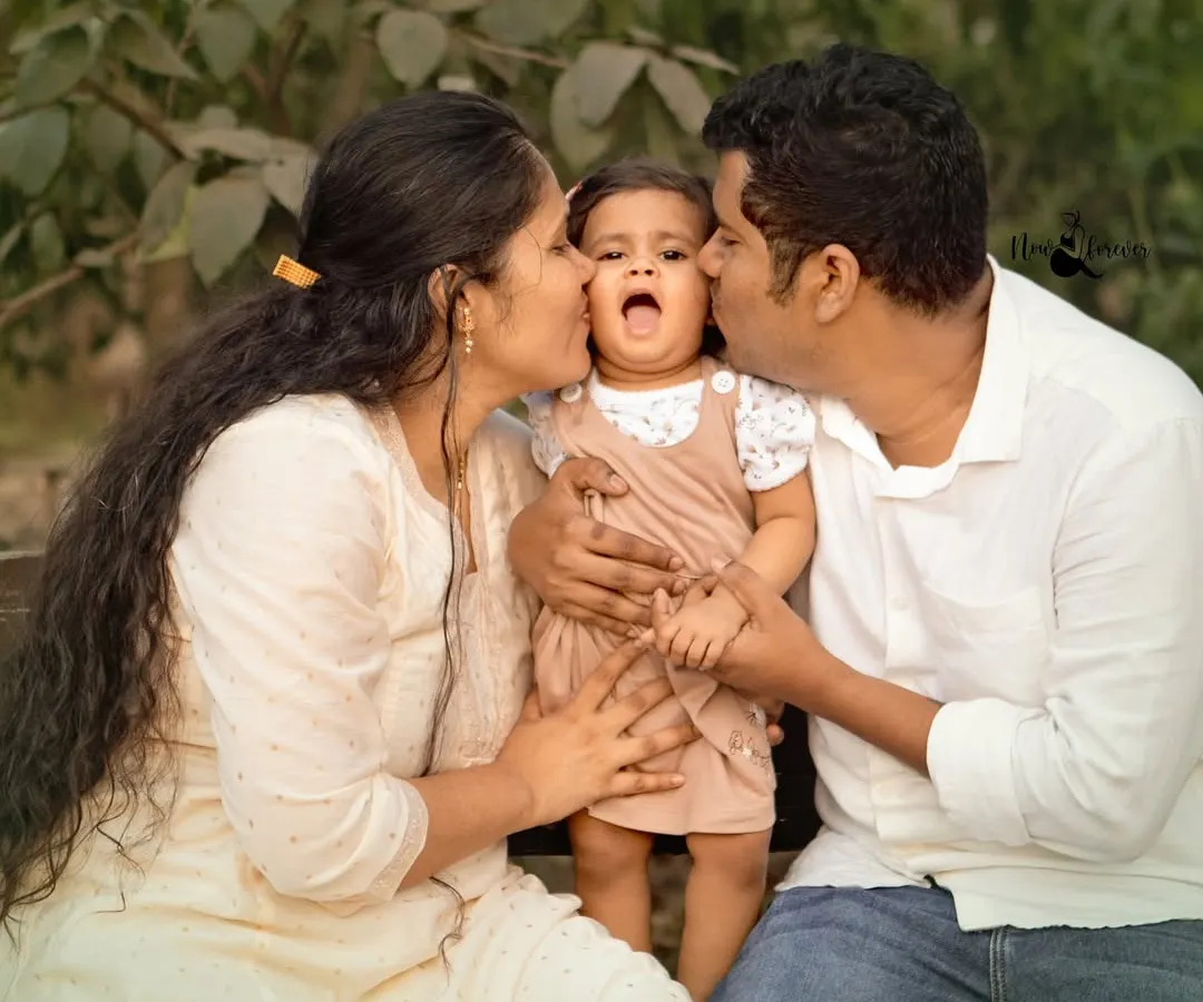 This is what it's all about. We live for these unposed, candid family moments where the love is so real you can feel it. A perfect memory from a first birthday photoshoot.