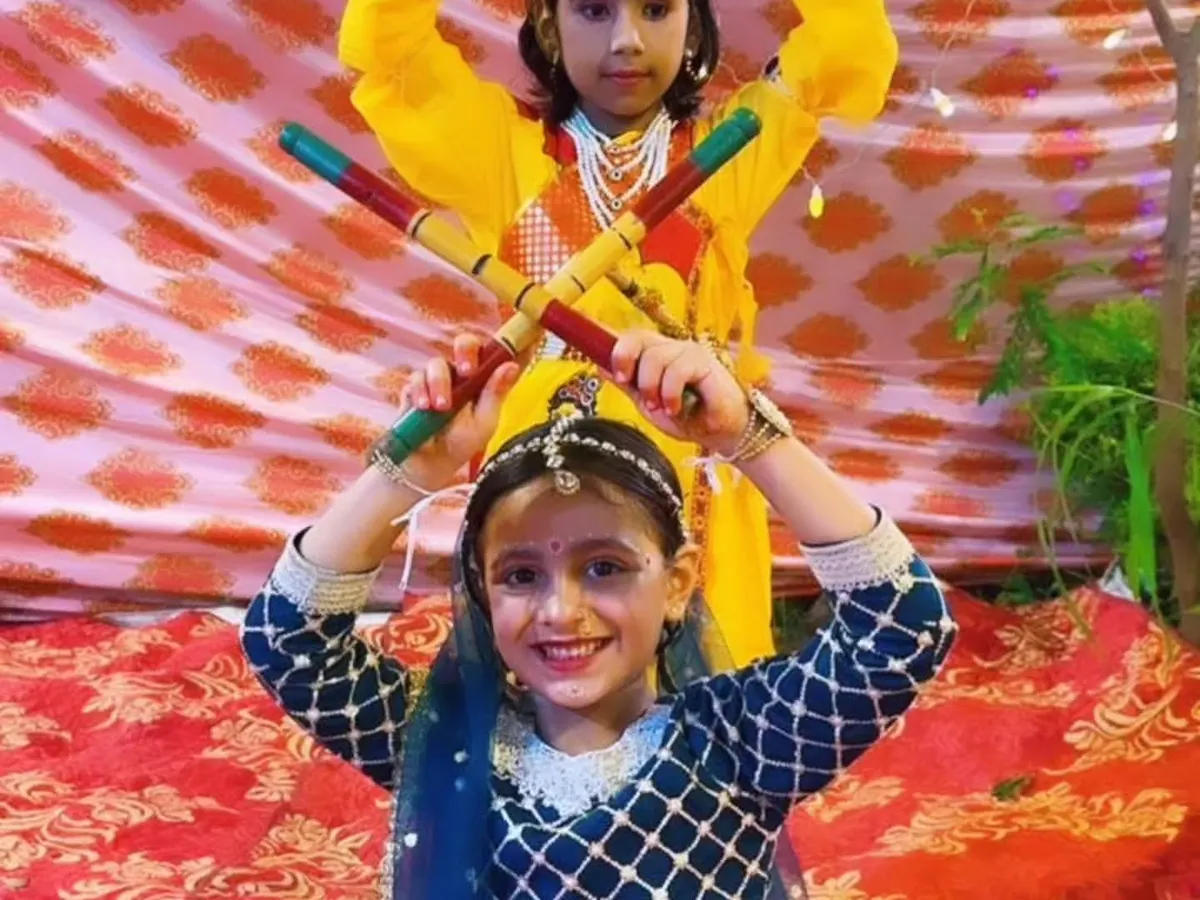 We love celebrating our culture with special themed performances. Here, our talented students are dressed as Radha and Krishna for a Janmashtami dandiya dance, creating beautiful memories while learning.