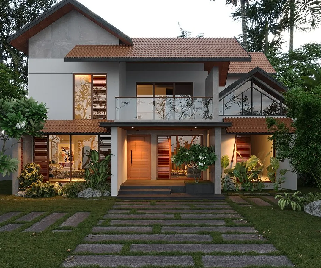 A prime example of my tropical fusion style, this home combines traditional sloped terracotta roofs with modern, large-format glass windows. The design ensures the home feels both contemporary and deeply rooted in Kerala's architectural heritage.