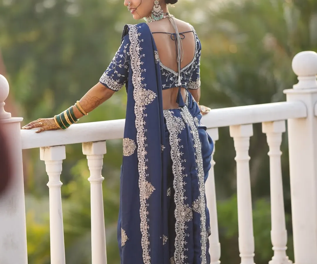 The final result is pure grace. This is a custom Vidhi look, where the drape is just as important as the makeup and hair to complete the bride's vision. Notice how the pallu is arranged to beautifully showcase the blouse and jewelry.