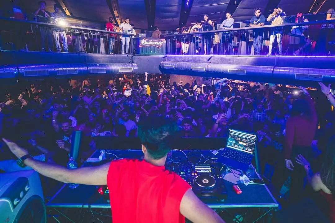 My view from the DJ booth at a packed club. I thrive on the energy of the crowd, mixing tracks that keep the dance floor full and the vibe electric all night long.