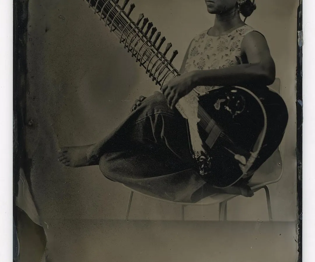 A timeless portrait of a musician with her sitar, created using the historic wet plate collodion process. This 19th-century technique gives each image a unique, soulful quality that digital photography cannot replicate.