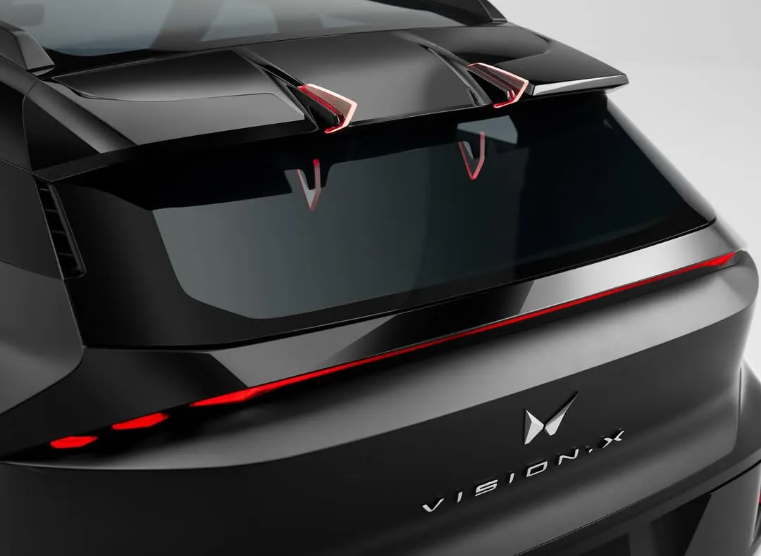 This is a detailed shot of a top-secret concept car for Mahindra. Automotive photography, especially for unreleased models, demands extreme precision in lighting to accentuate every design line while managing reflections on the unique matte finish.