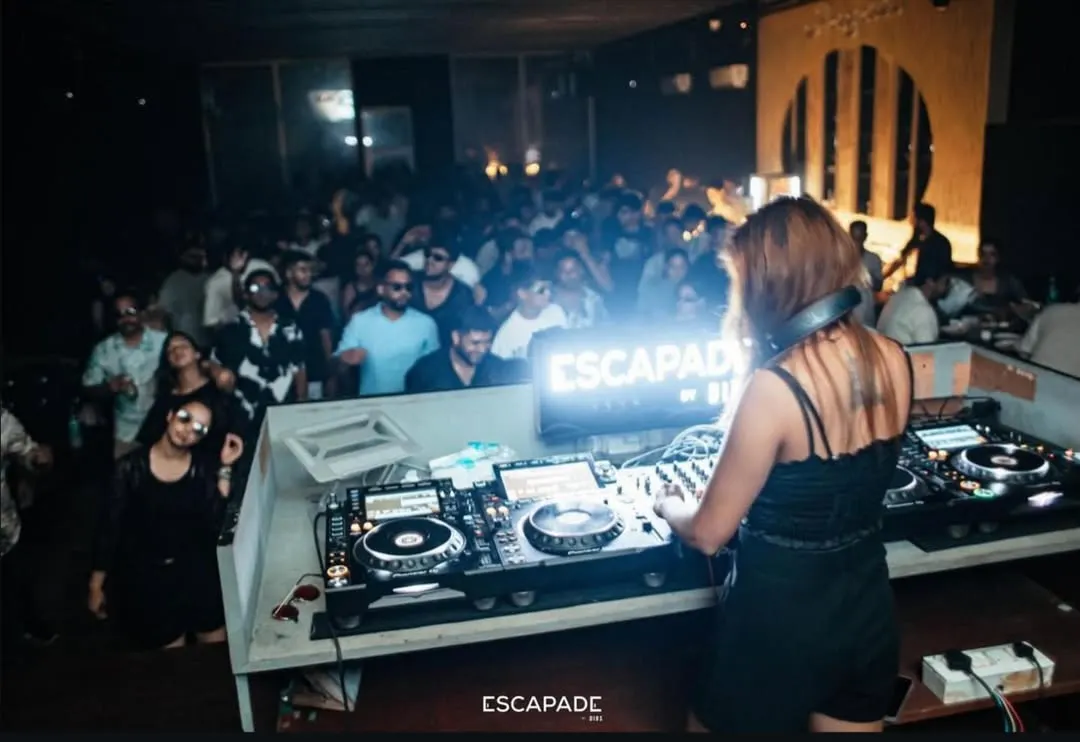 My view from the console, looking out at a sea of people lost in the music. Keeping the dance floor packed and the energy high is what I do best, whether it's an underground rave or a peak-hour club night.