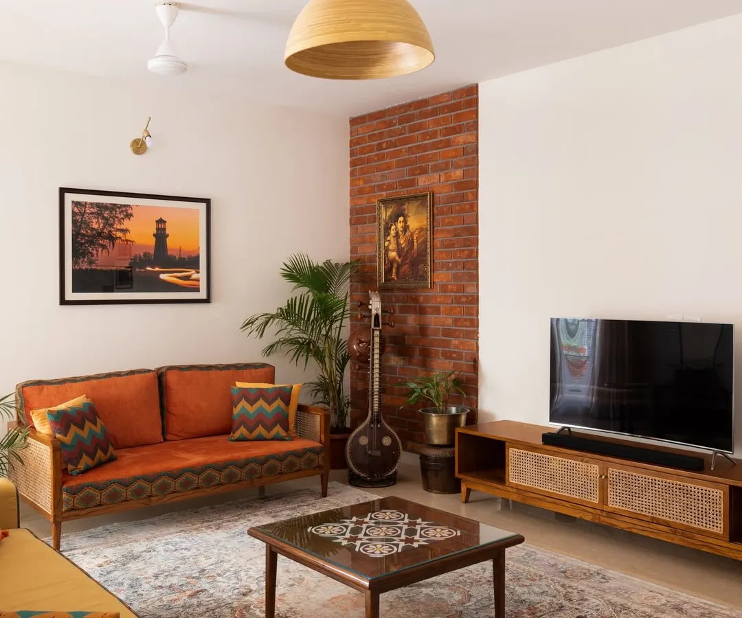 A complete living room setting featuring our Ramaniyam collection, which we created through a close collaboration with our client. This space showcases how we can customize an entire suite of furniture, including the sofa, center table, and TV unit, to reflect a client's personal story and cultural roots.